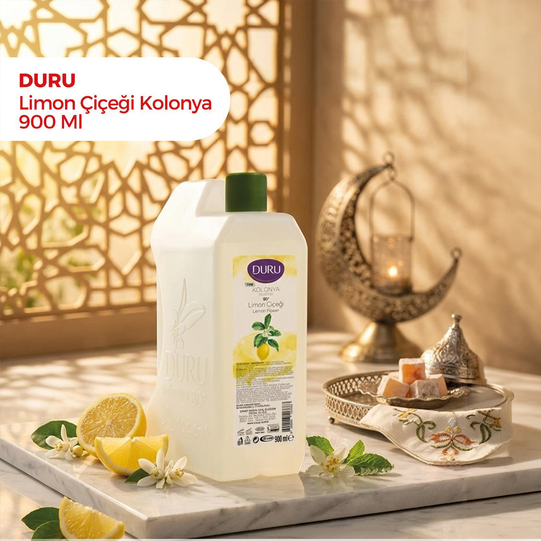 Colonia Duru Limon en botella blanca de plástico con tapón verde y etiqueta amarilla decorada con limones.